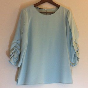 Blouse with ruched sleeves